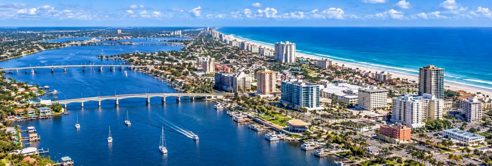 Aerial view of Daytona Beach with the beachfront, bridges and Halifax River